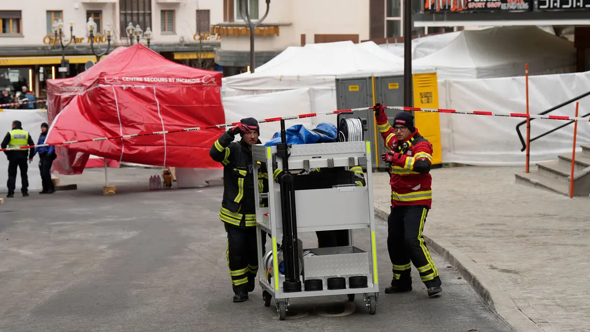 Bar owner says he found several people dead behind locked back door after New Year's Eve fire