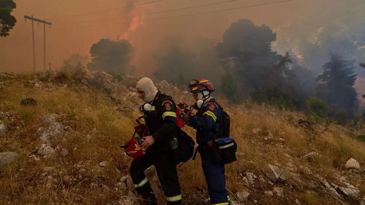Athens wildfires subside, but officials warn they could flare up again