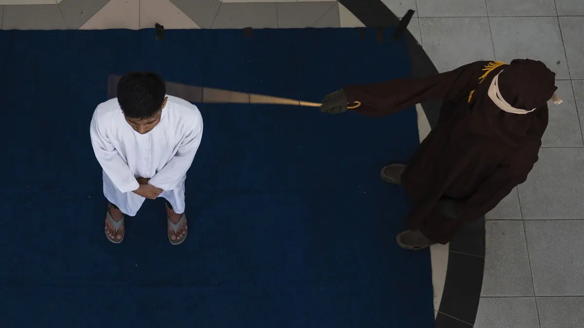 Couple sentenced to caning for sex outside of marriage in Indonesia