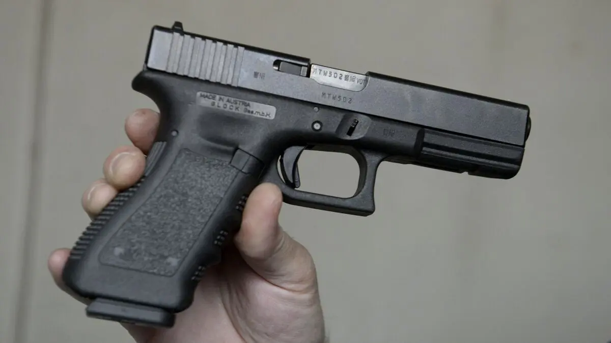 Soldier practicing pistol draw at