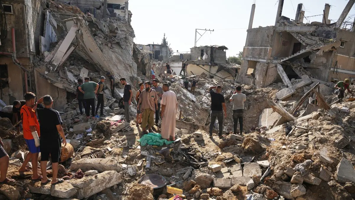 At least 13 killed in Israeli attacks on Gaza homes and hospitals, Hamas says
