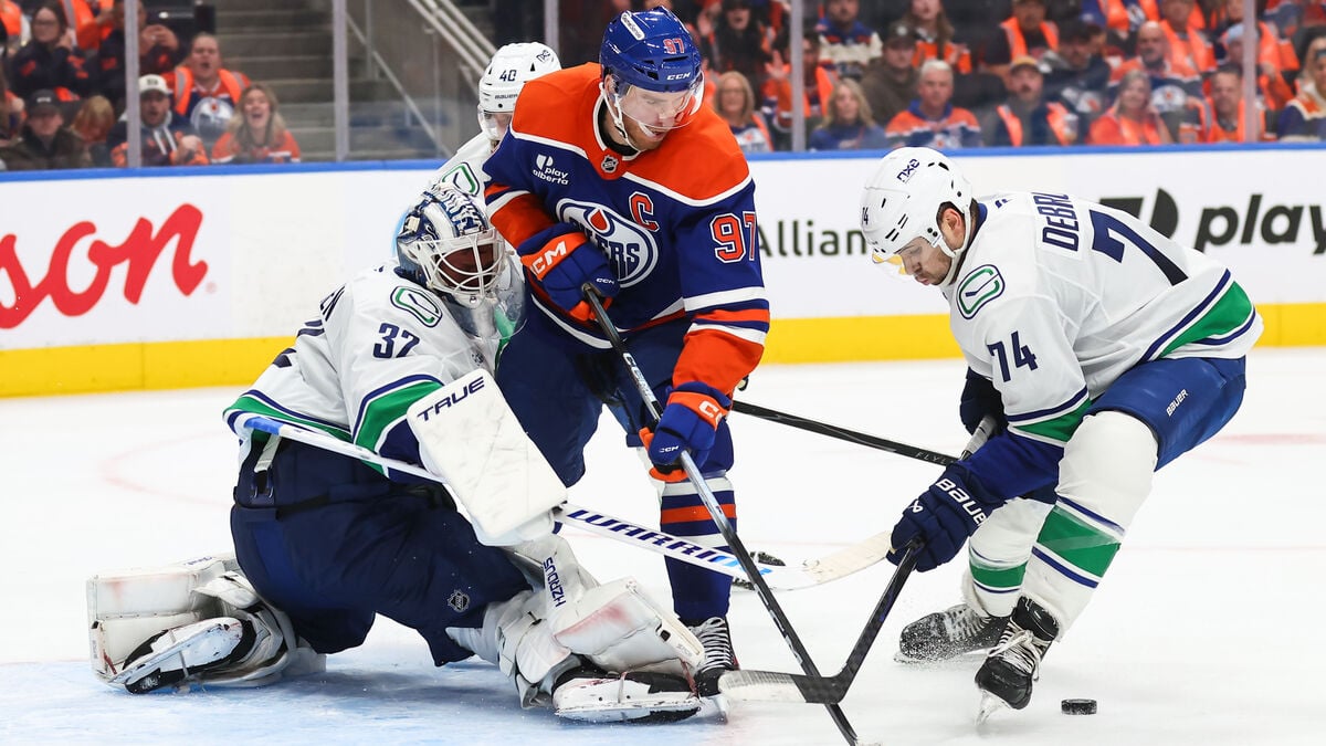 Vancouver stuns Edmonton with overtime win in NHL opener