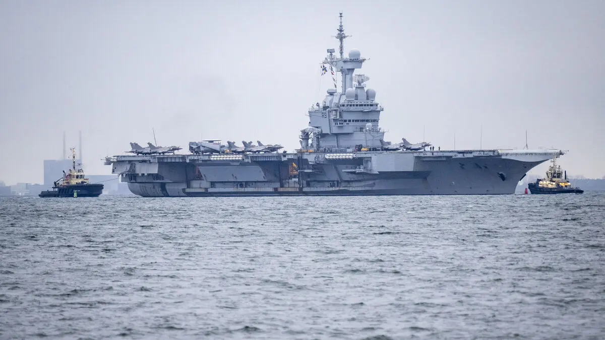 Nuclear-powered aircraft carrier docks in