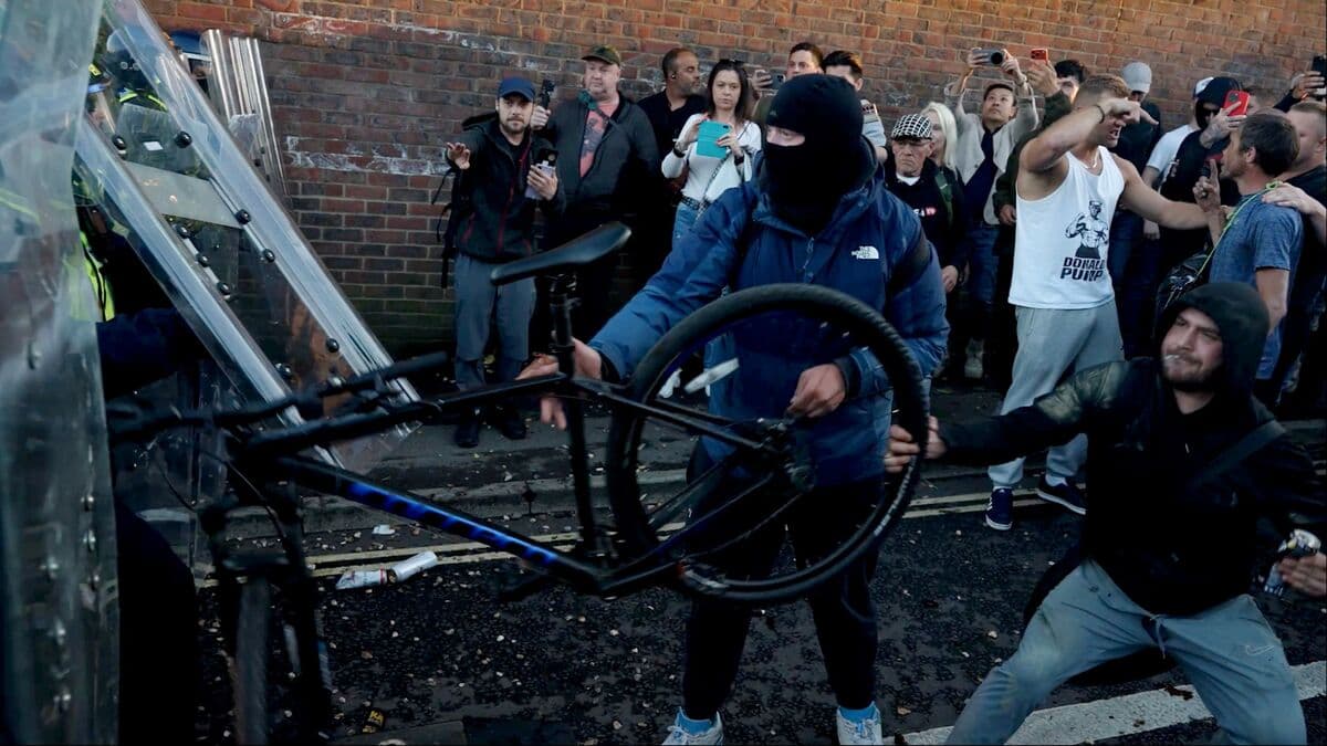 Two men jailed over British police protest