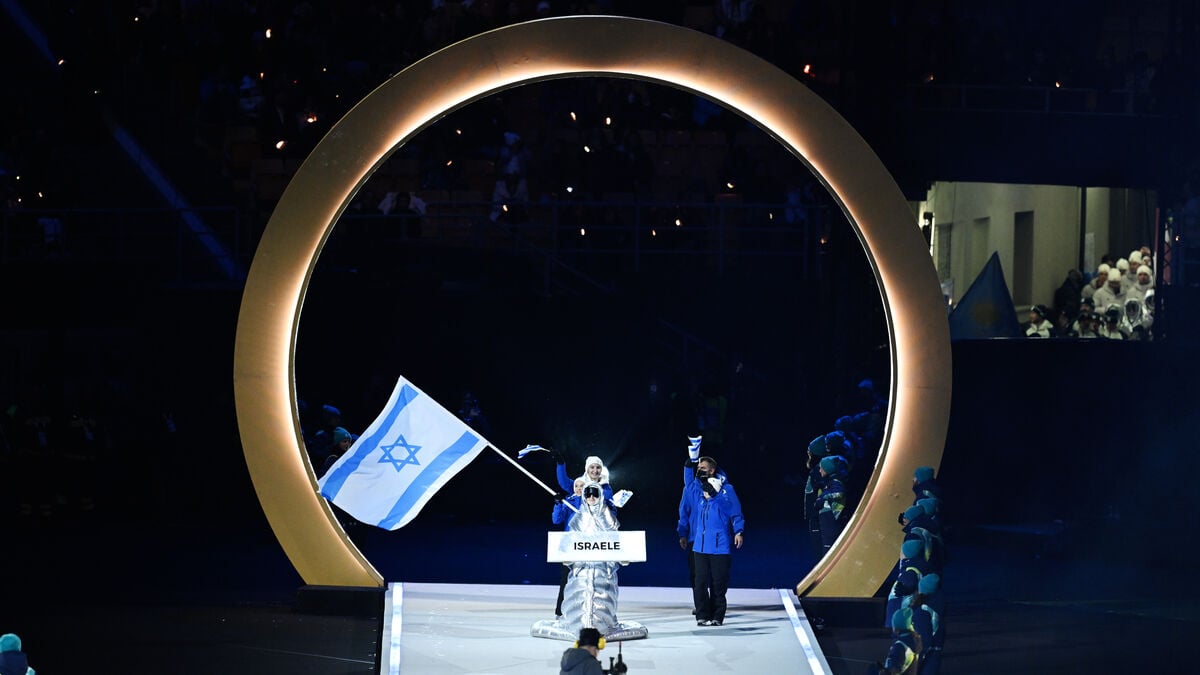 The Olympic flame was lit as the USA and Israel were booed