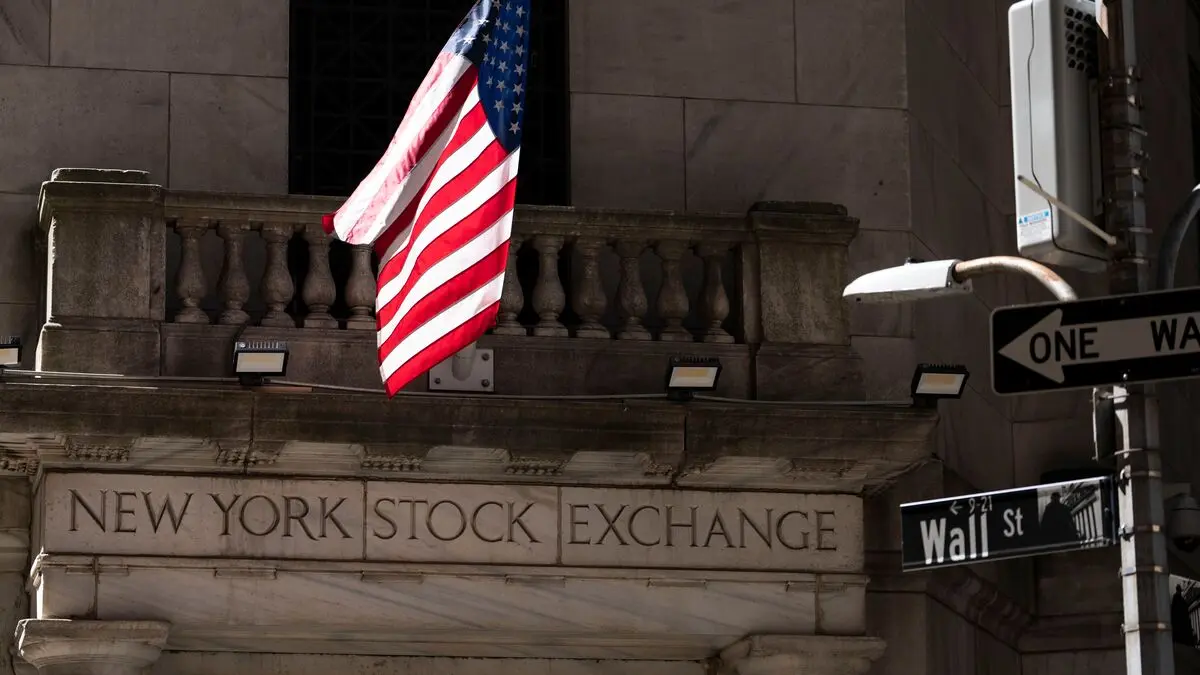 Wall Street falls as chip giants Qualcomm and Intel buck the trend