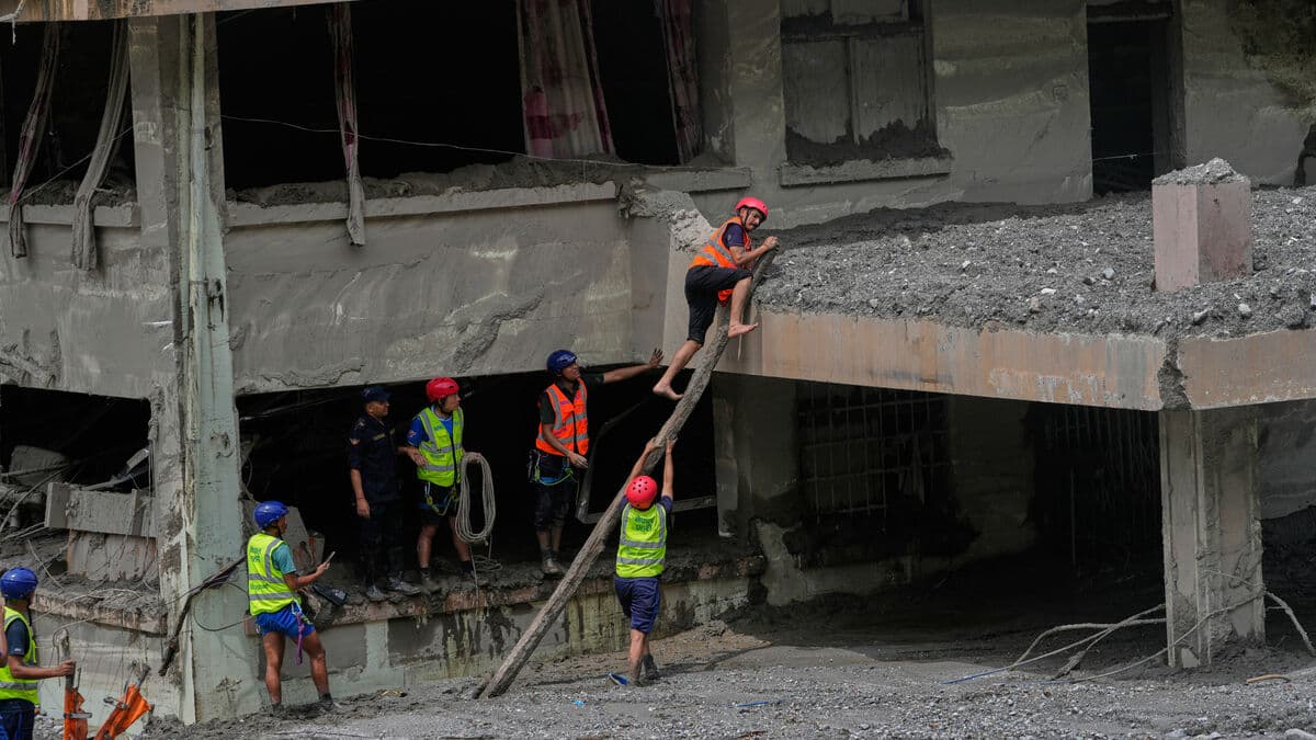 Nepal says rescue efforts for trapped workers are making progress after deadly floods and landslide disaster
