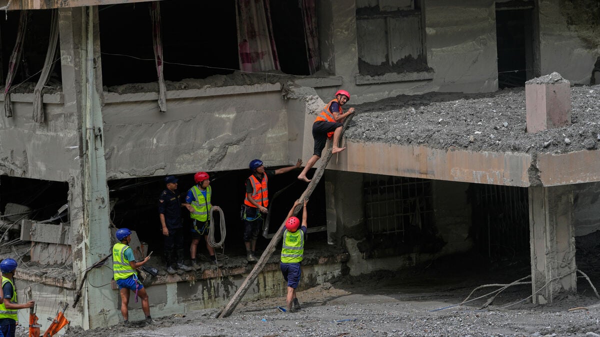 Nepal says rescue efforts for trapped workers are making progress after deadly floods and landslide disaster