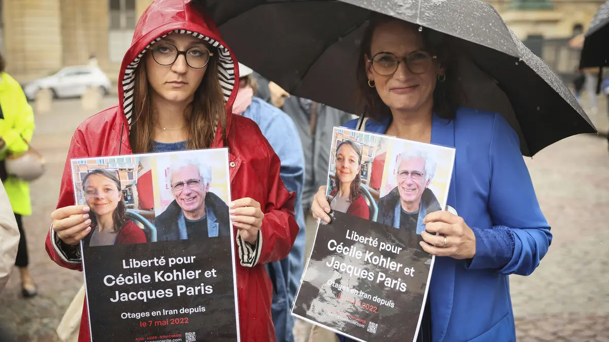 Macron says imprisoned French couple are on their way home