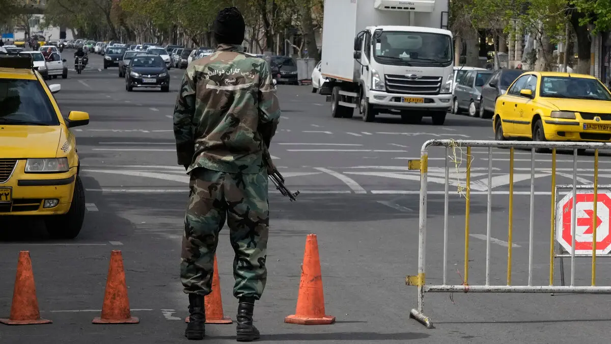 Iran's militia recruits children to patrol streets with weapons