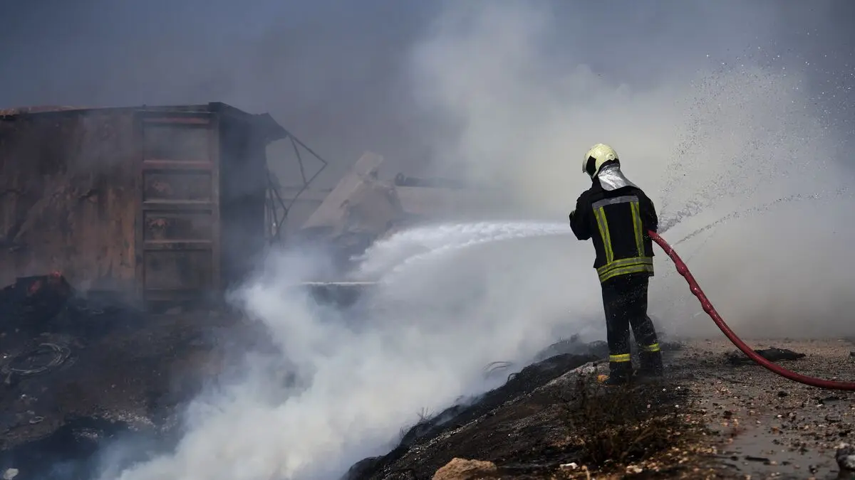 At least 14 killed in explosion at arms depot in northwest Syria