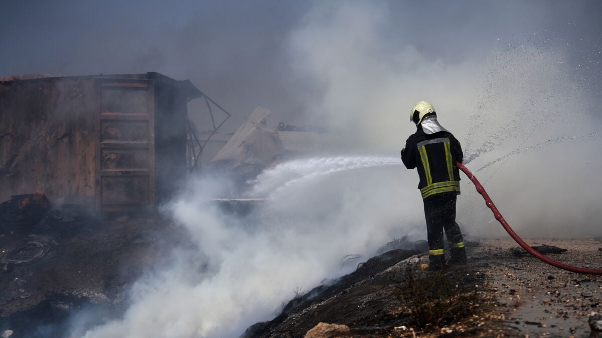 At least 14 killed in explosion at arms depot in northwest Syria