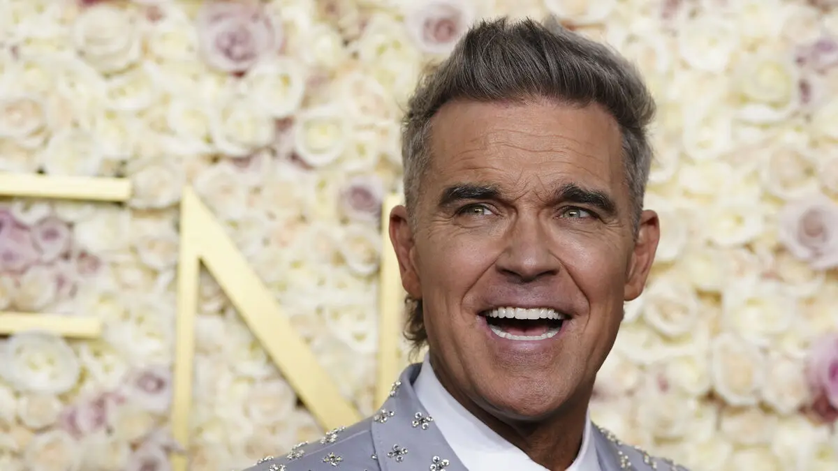 Robbie Williams breaks Beatles' old record for UK number one albums