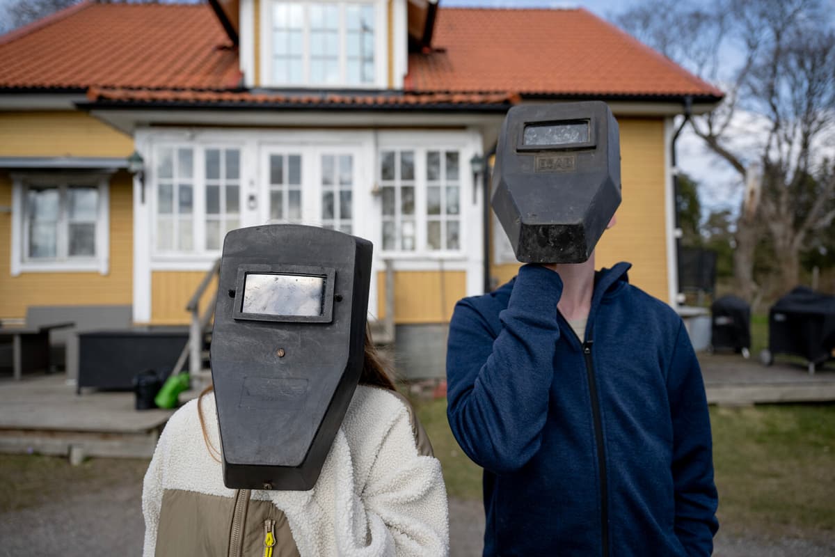 Siblings in Sweden Marvel at Rare Solar Eclipse with Welding Masks