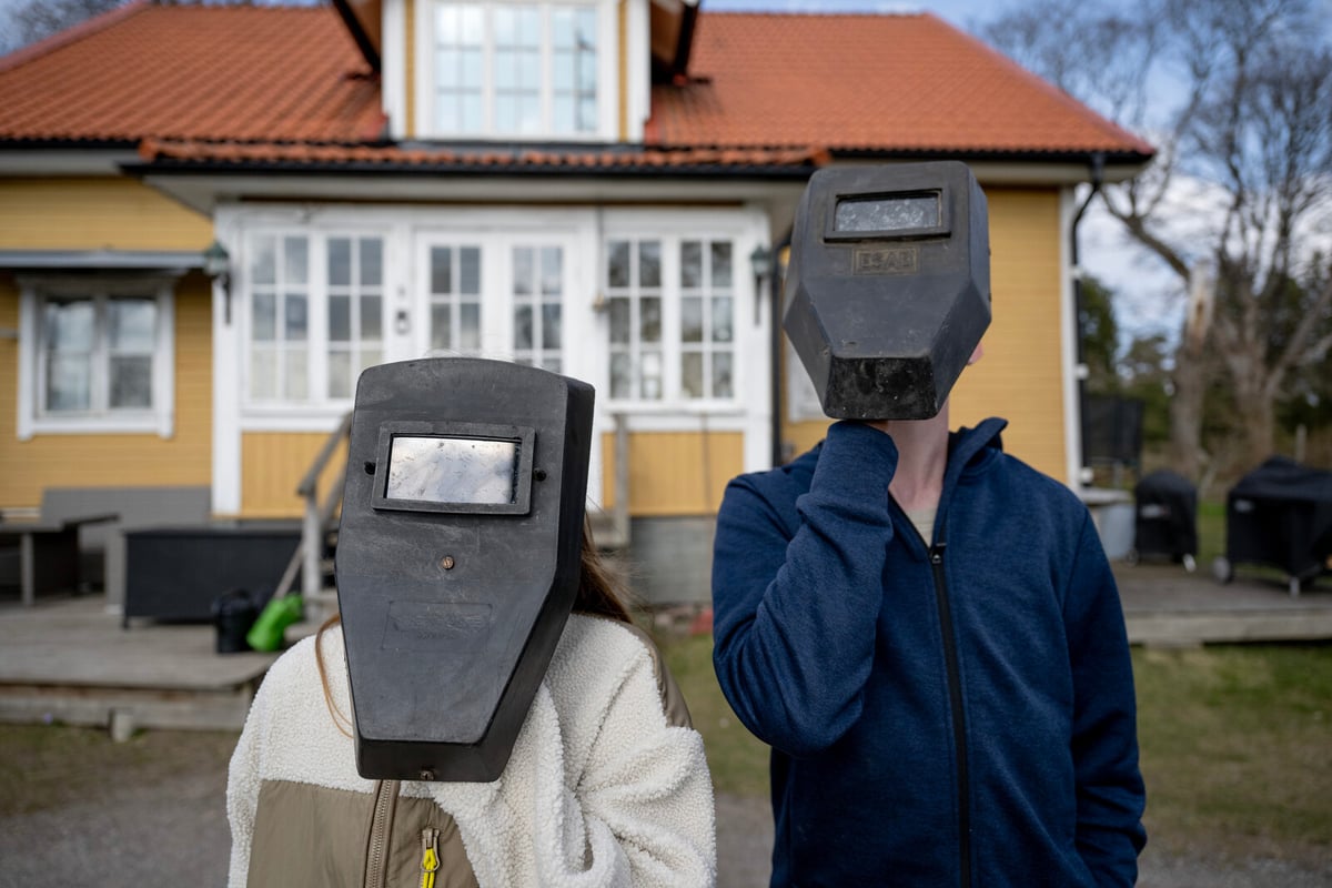 Siblings in Sweden Marvel at Rare Solar Eclipse with Welding Masks