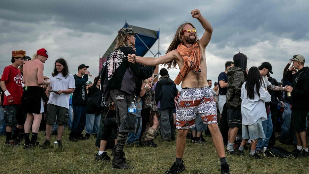 Tens of thousands of revellers dance amid duds at illegal party on military site near Bourges