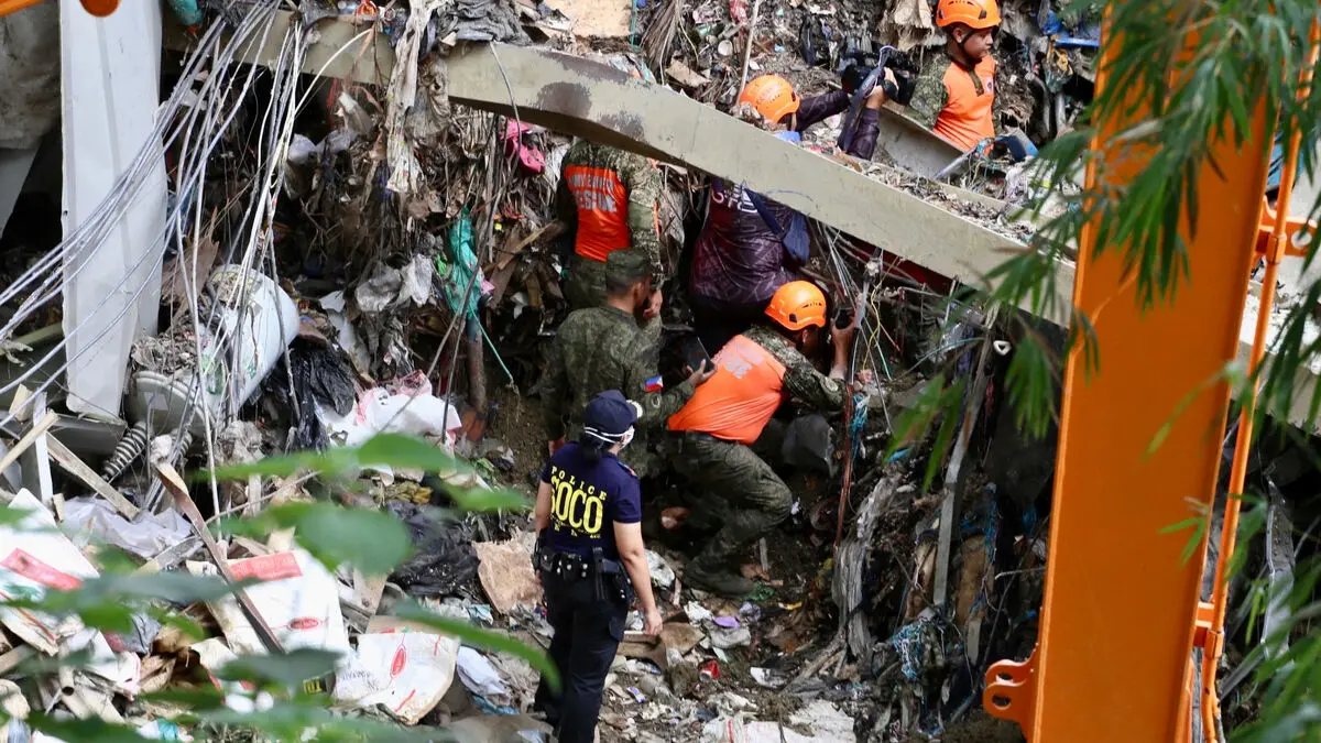 Dozens missing after Sopras garbage dump collapse in central Philippines as rescuers report signs of life