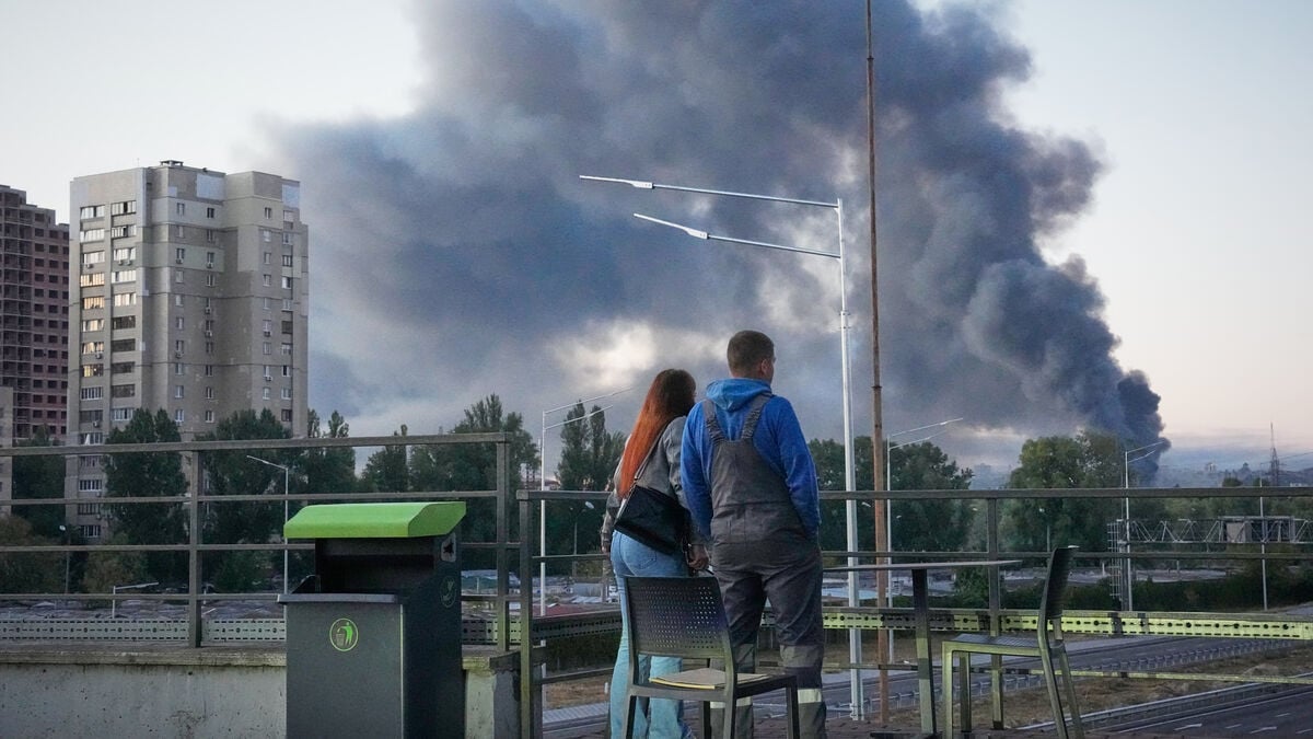 Russian attacks on Kyiv kill at least two, TV station hit in drone strike