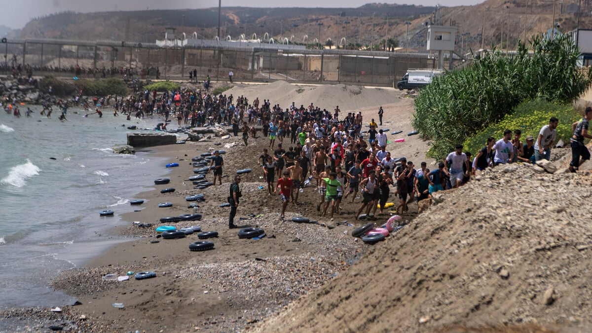 Spain sends military to Ceuta as thousands of migrants cross border