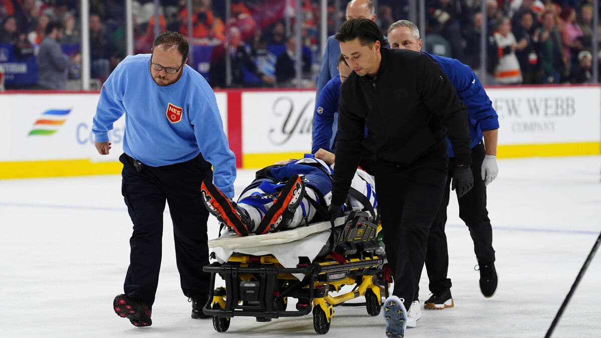 Tanev had to be lifted off the ice after a nasty collision