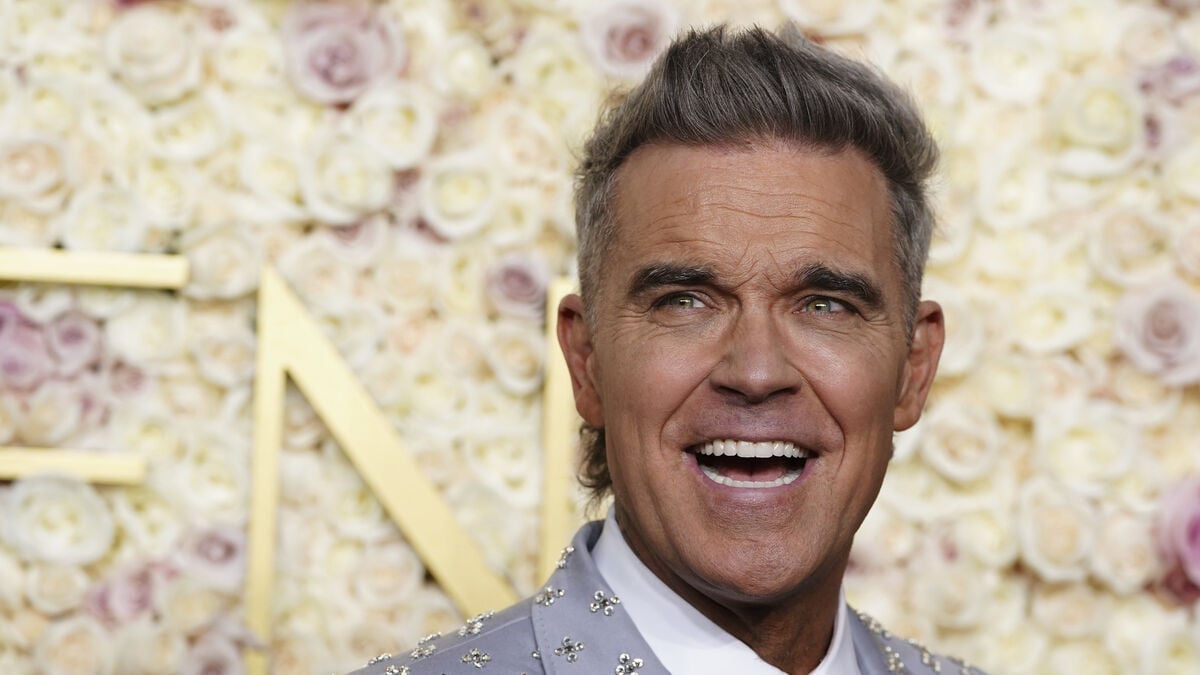 Robbie Williams releases new album Britpop three weeks earlier than expected