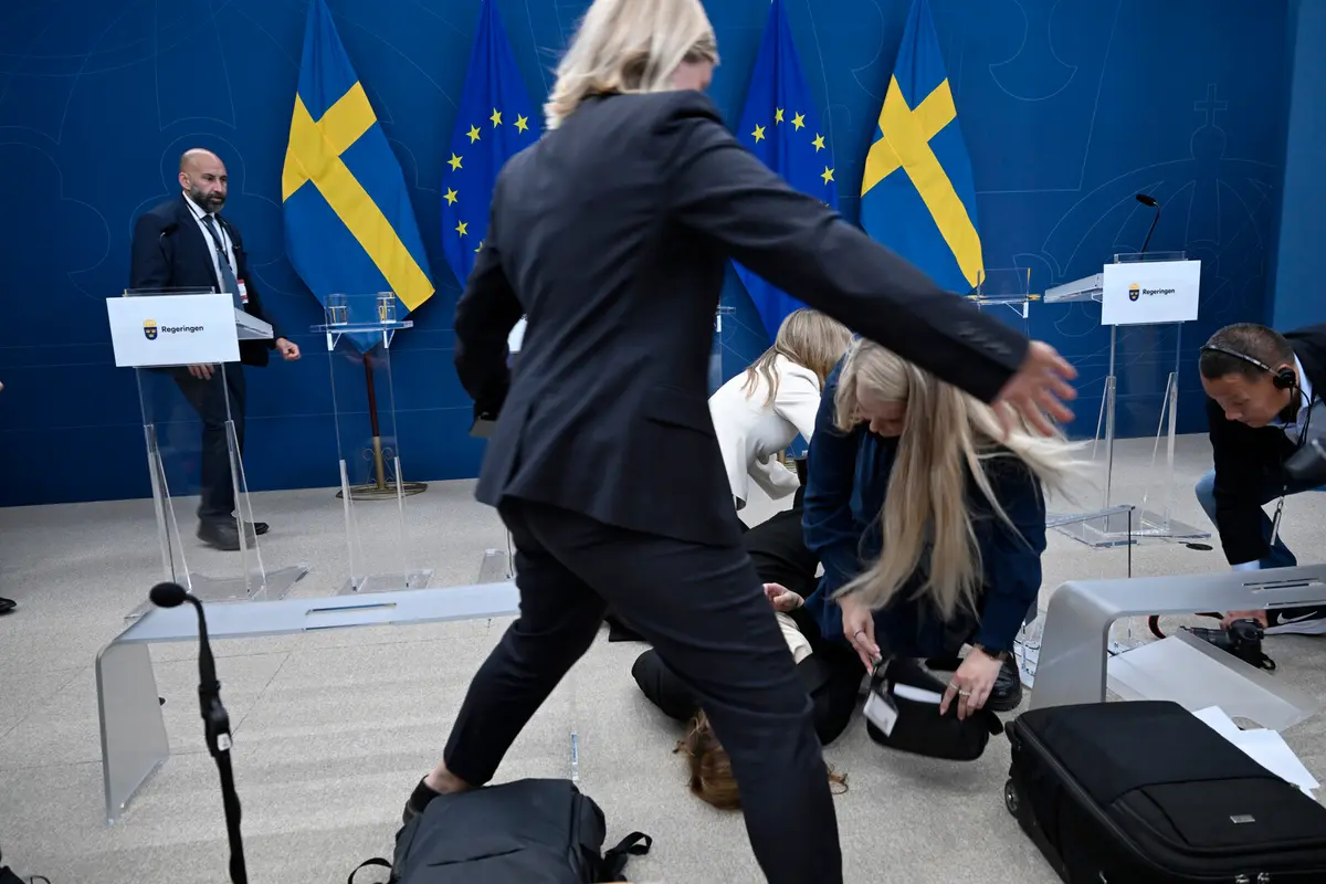 Sweden's Health Minister Elisabet Lann Collapses at Press Conference