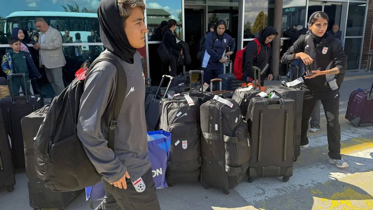 Iran's women's soccer team hailed on return to Tehran