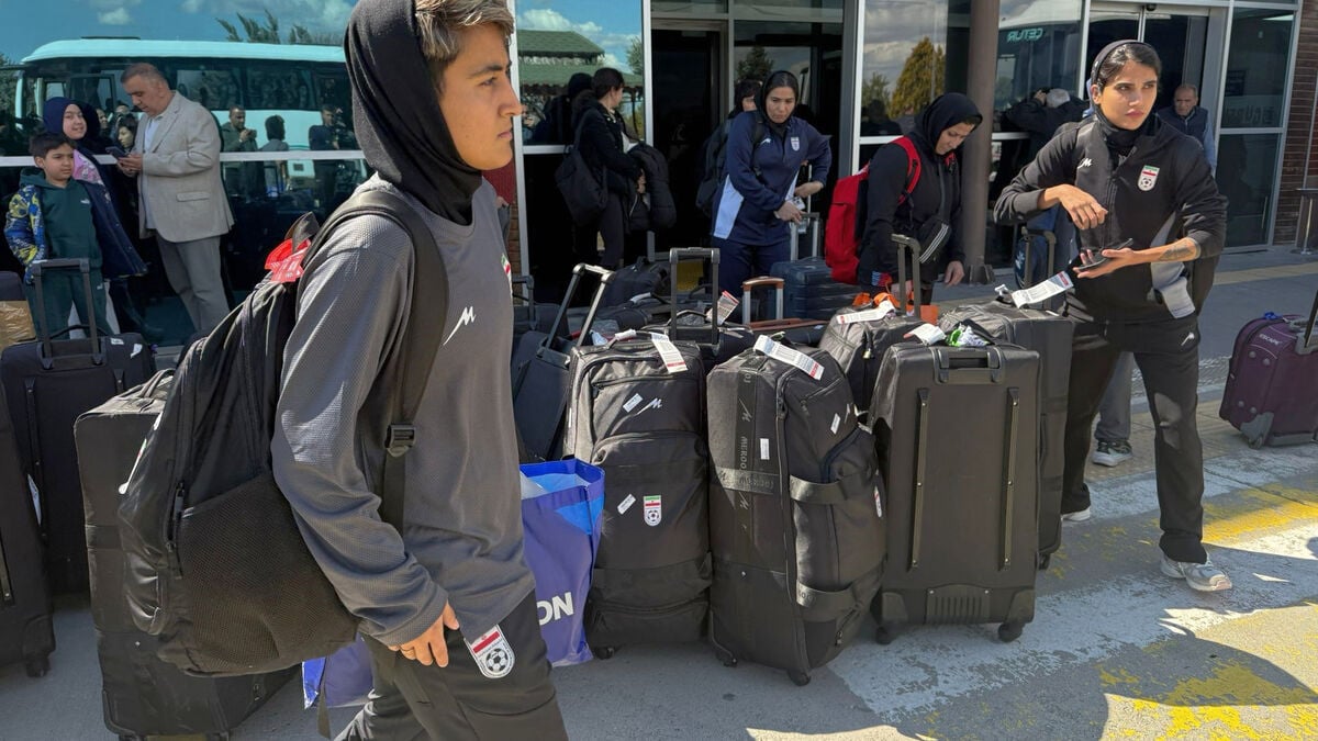 Iran's women's soccer team hailed on return to Tehran