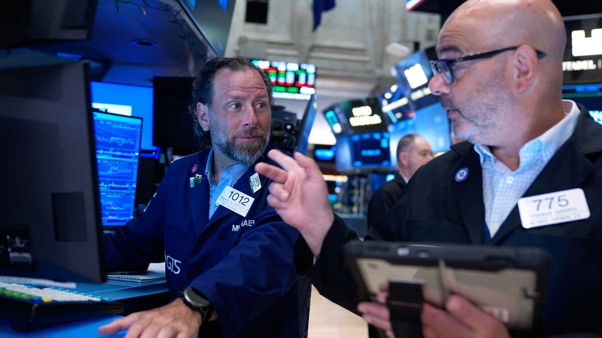 Wall Street falls as oil prices surge and chip stocks slide
