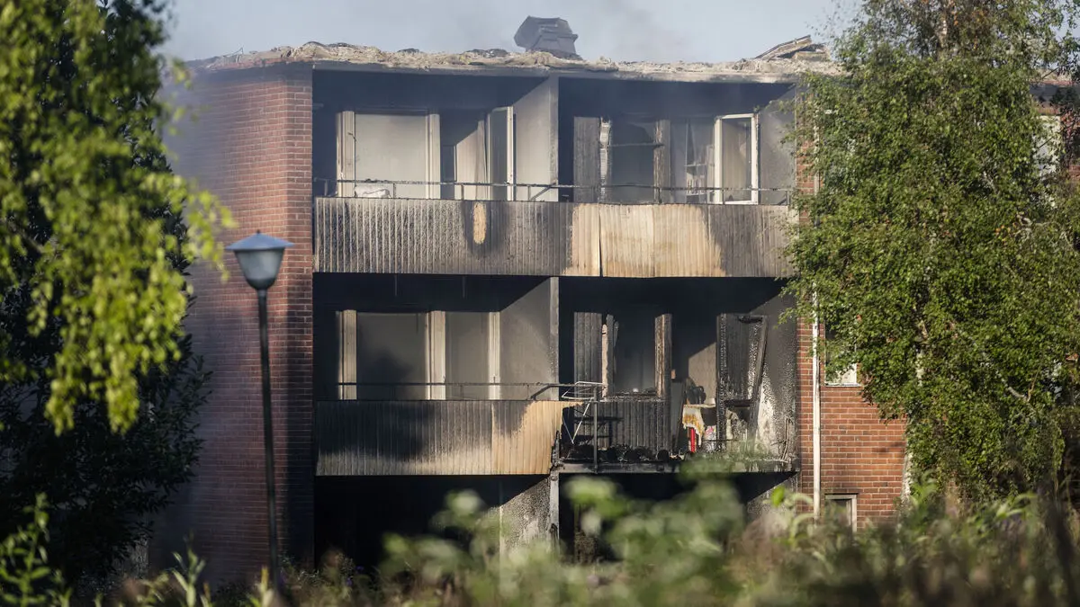 Woman charged with major fire