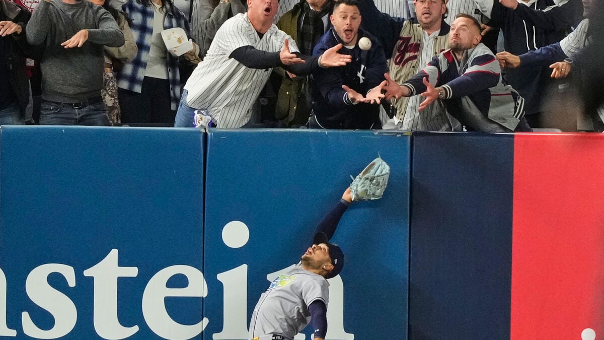 Yankees fan escorted from stadium after interfering with potential home run in playoff loss