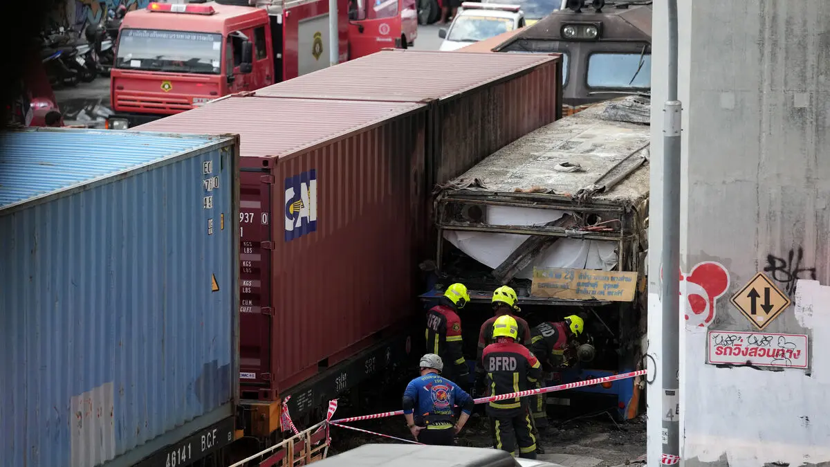 Freight train hits bus at Bangkok intersection, at least eight dead