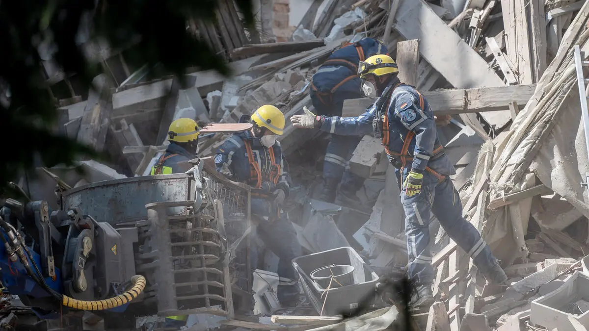 House collapses in suspected gas explosion, three missing