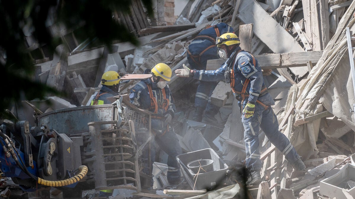 House collapses in suspected gas explosion, three missing