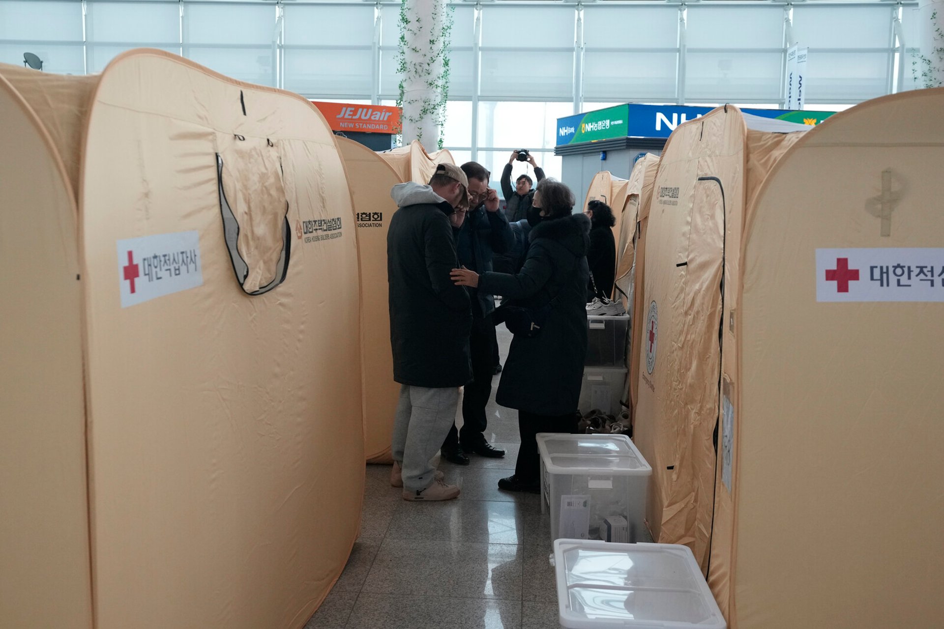 Tears and Fury among Relatives at the Airport