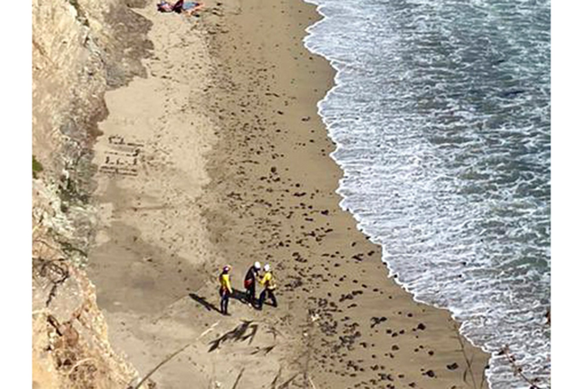 Surfer wrote "HELP" on beach – rescued