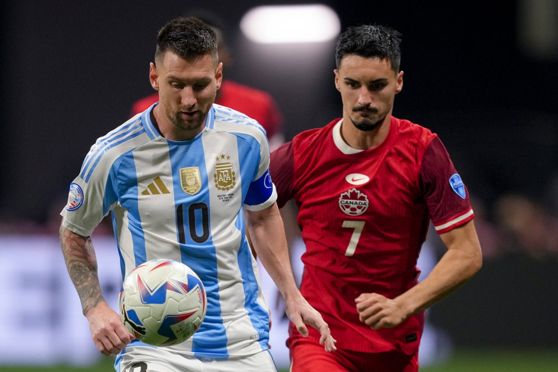 Argentina<|start\_header\_id|> assistant referee eventually gave Argentina a free kick after a foul on Canada's Scott Arfield