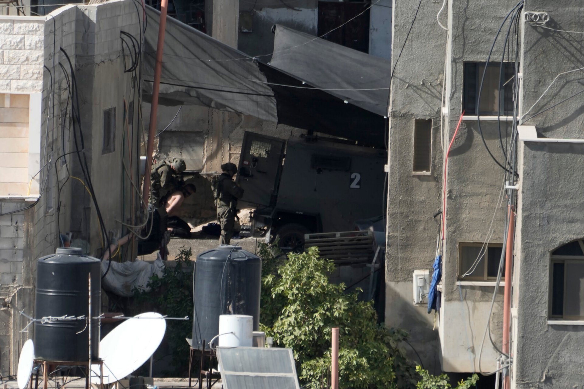 Israeli soldiers pushed bodies off a rooftop