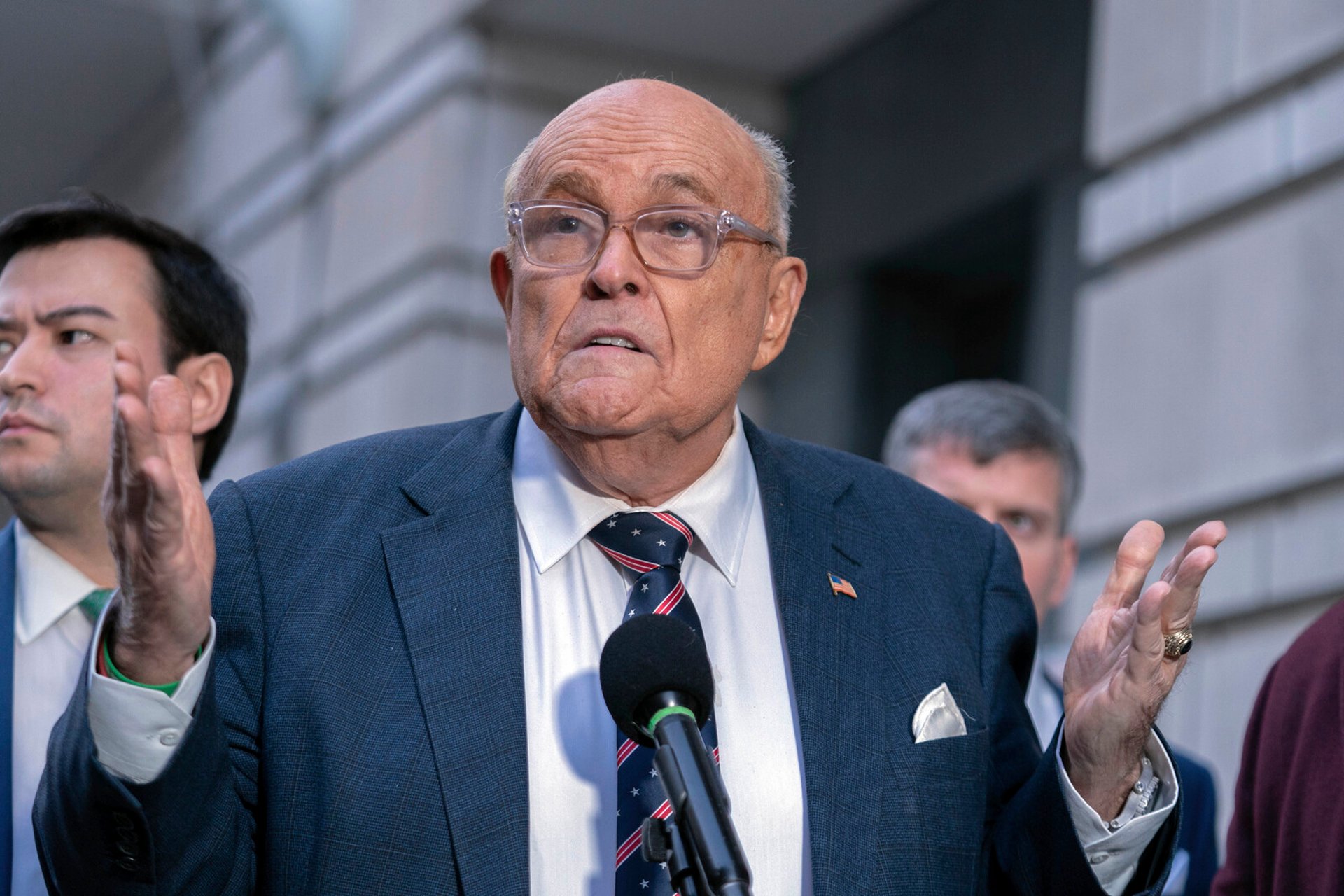 Giuliani settles for millions in