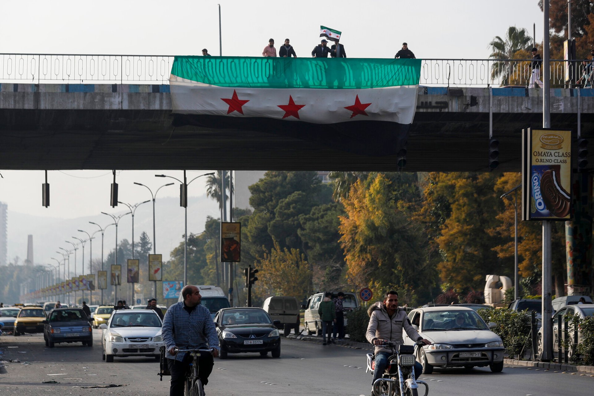 Kurds in Syria hoist the opposition flag