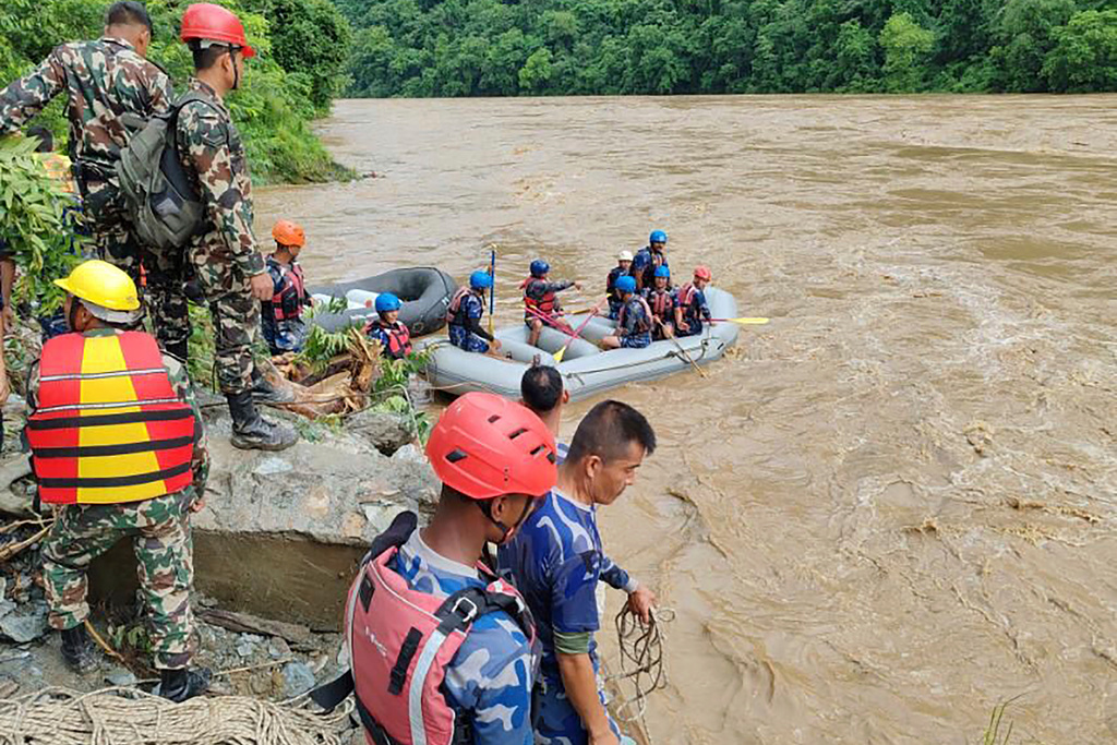 Buses swept away by landslide – dozens missing