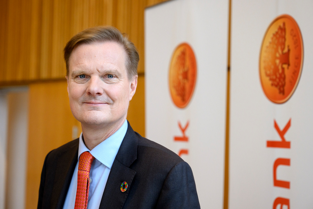 Swedbank's profit falls less than feared