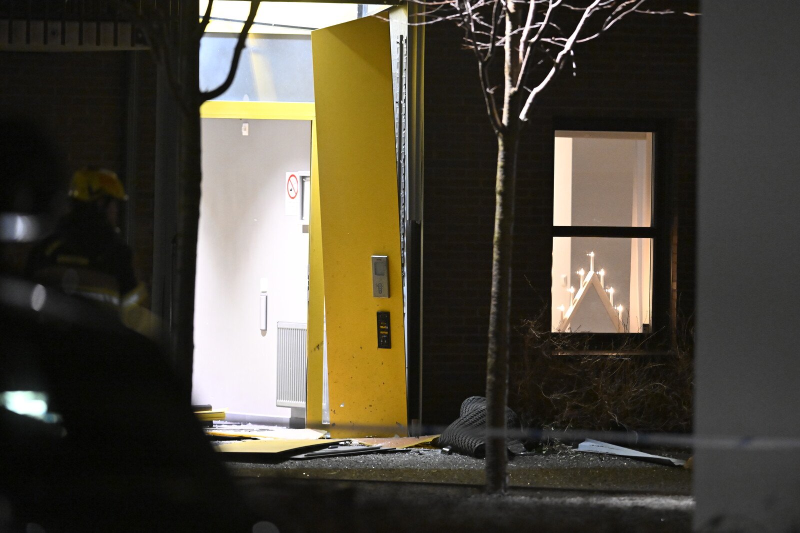 Front door to apartment building blown off