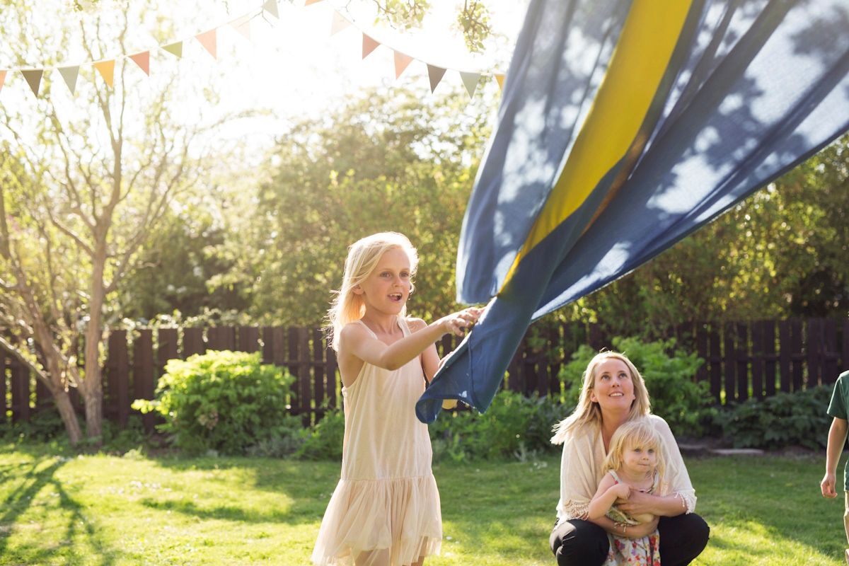 Photo of a Swedish Family holding the Swedish flag