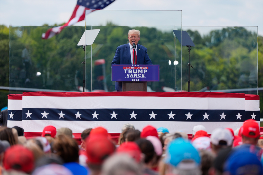 Trump spoke behind bulletproof glass